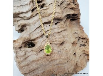 One (1) 14K Yellow Gold Necklace Features A Pear Mixed Cut Peridot (2.00 Carats) Total Weight 11.01grams