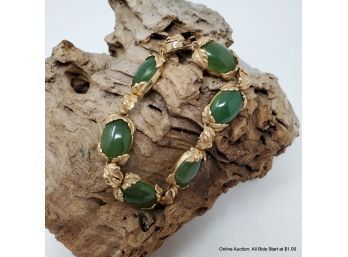 14K Bracelet Features A Floral Design, Set With Six Oval, Nephrite Cabochons Measuring 8in Weight 33.22grams