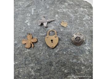 Collection Of Five (5) Assorted Base Metal Charms.