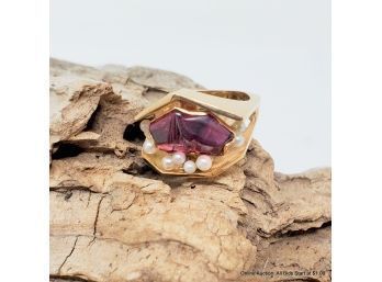 One 14K Yellow Gold Ring Features Fantasy Cut Garnet And Nine (9) Seed Pearls. Ring Weighs 9.01 Grams.