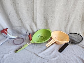 Strainers And A Measuring Cup