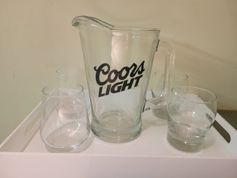 Coors Light Glass Pitcher With 4 Glasses  On A  Plastic Tray