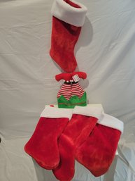 4 Christmas Stockings And A Hat