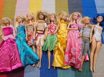 9 Barbie Dolls With Clothing
