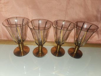 4 Glasses With Gold Stripes And Gold Stem And Bottom