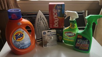 Laundry Detergent Cleaners Light Bulbs And An Iron