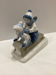 Porcelana De Cuernavaca Children Sledding Statue