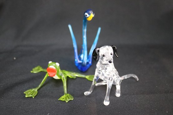 A Swarovski Crystal Dog And Two Hand Blown Murano Glass Animal Figurines.