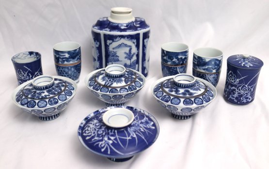 Lot Of Japanese Blue And White Tea Bowls With Lids, Cups, And Porcelain Tea Caddy.