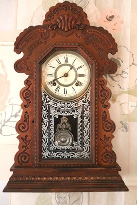 Antique Ansonia Wall Clock In Victorian Style Pressed Wood Frame With Decorative Glass Front And Pendulum