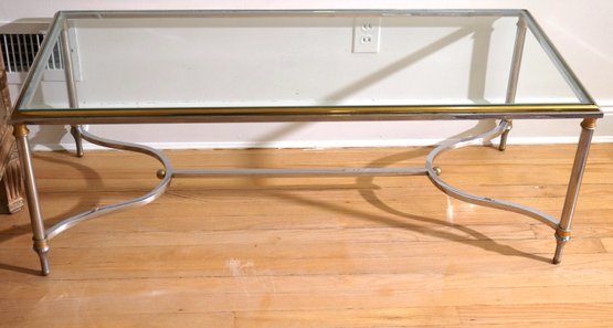 Hollywood Regency Glass Top Table With Polished Nickel With Brass Accents.