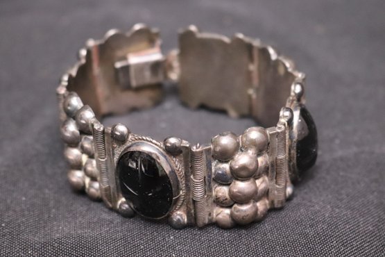 Vintage 1940s Sterling Silver Signed Mexican Bracelet With Carved Onyx Faces.