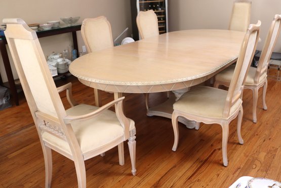 Oval Dining Table In A Bleached White Oak Like Finish, Includes 6 Chairs With A Custom Cream Toned Fabric