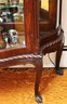 Antique Carved Tiger Oak Wood/Glass Curio Cabinet With Carved Claw Feet, Glass Shelves, Curved Glass