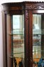 Antique Carved Tiger Oak Wood/Glass Curio Cabinet With Carved Claw Feet, Glass Shelves, Curved Glass