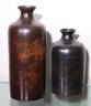 Pair Of Decorative Metal Jugs With A Rubbed Copper Like Finish