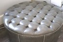 Contemporary Grey Faux Leather Tufted Ottoman With Nail Heads