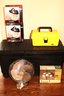 Storage Box, 2 Deluxe Face Shields New In Box, Small Yellow Tool Box. Vornado Fan