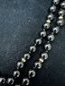 14K YG 36 INCH POLISHED DOUBLE STRAND ONYX BEADED NECKLACE WITH DIAMOND ENCRUSTED CLOSURE BY MILDRED SAVITT