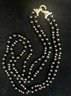 14K YG 36 INCH POLISHED DOUBLE STRAND ONYX BEADED NECKLACE WITH DIAMOND ENCRUSTED CLOSURE BY MILDRED SAVITT