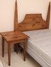 A Shaker Style Poster Twin Headboard With Shiffman Mattress And Box Spring, And Pine Side Table.