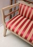 English Style Pickled Wood Framed Settee With Upholstery In Red And Tan Stripes.