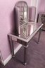 Stylish Mirrored Vanity Table Painted In A Modern Metallic Gray With Mirror Attachment