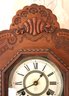 Antique Ansonia Wall Clock In Victorian Style Pressed Wood Frame With Decorative Glass Front And Pendulum