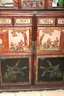 Vintage Carved Asian Cabinet With Depictions Of Warriors In Garden Setting On The Doors