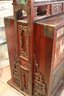 Vintage Carved Asian Cabinet With Depictions Of Warriors In Garden Setting On The Doors