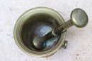 An Antique Brass Mortar And Pestle