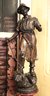 Antique Metal Statue Of The Miner With Bronze Patina On Wooden Base.