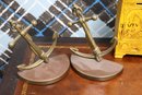 Vintage Decorative Metal Items With Brass Anchor Bookends, Mini Cannons, And Clay Bank.