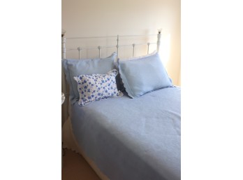 Full Bed With White Metal Headboard