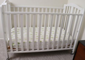 White Crib On Wheels With Blended Organic Cotton Mattress.