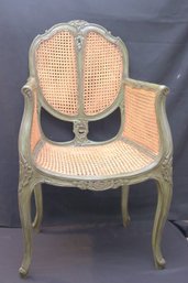 Antique French Style Green Painted Armchair With Double Caned Back And Sides.