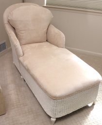 Wicker Chaise With Beige Suede Upholstery.