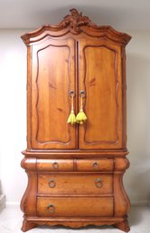 French Provincial 2-piece Armoire With Bombe Style Drawers In A Honey Tone Wood Finish