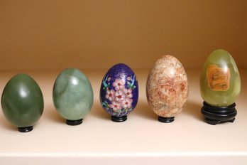 An Assortment Of 5 Decorative Eggs With Cloisonn And 4 Polished Stone Styles With Stands.