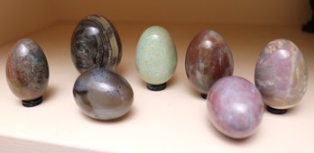 Assortment Of 7 Polished Stone Eggs On Small Stands,