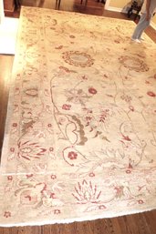 Beautiful Cream Colored Handmade Quality Carpet With Red, Brown And Light Blue Details.