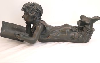 Resin Sculpture With A Bronze Toned Finish Of A Little Boy Reading