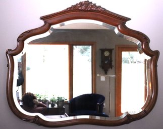 Elegant Early 20th Century Beveled Mirror In Curved Wood Frame With Floral Crown