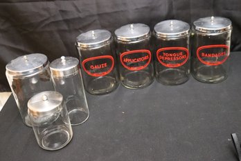 A Lot Of Seven Glass Canisters With Metal Lids For Doctors/ Surgical Use.