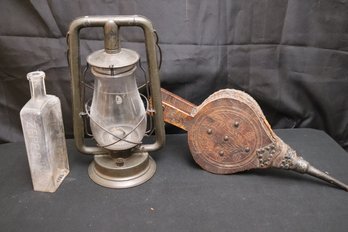 Rustic Collectables Include Bellows, Lantern And Antique Glass Bottle