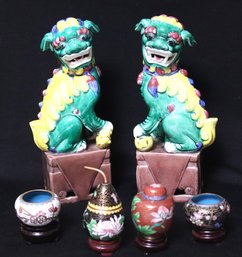 Interesting Asian Lot Includes Two Porcelain Foo Dogs, And Four Piece Miniature Cloisonne Set With Stands
