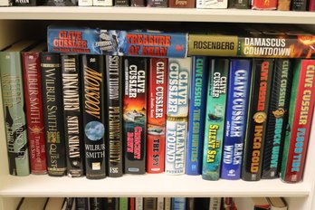 Collection Of Novels Authors Include Clive Cussler, Wilbur Smith, Jeffrey Archer And Steve Shagan