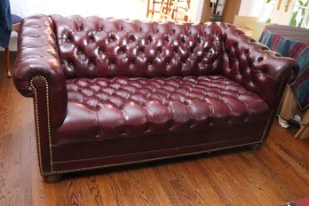 Fine Chesterfield Style Tufted Genuine Top Grain Leather Burgundy Loveseat With Nail Head Accents Along The Ed