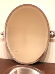 Wall Mounted Swivel Mirror With A Beveled Edge