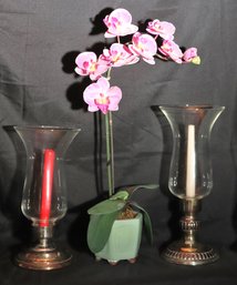Includes 2 Decorative Glass Hurricane Candle Holders With A Faux Orchid Plant